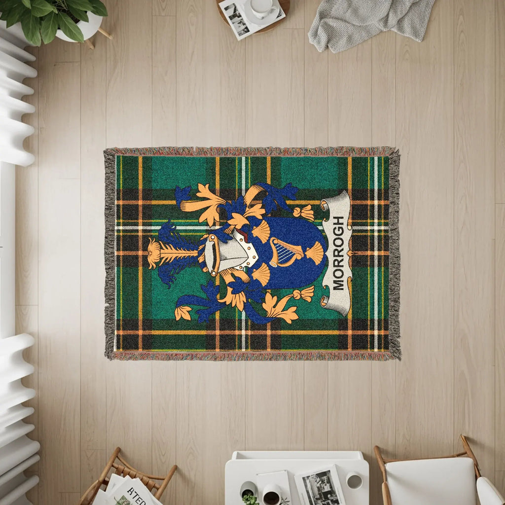 Woven throw blanket with green tartan and Morrough clan crest.