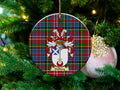 Halliday Scottish clan ceramic ornament with family crest on a Caledonia tartan background, hanging on a Christmas tree