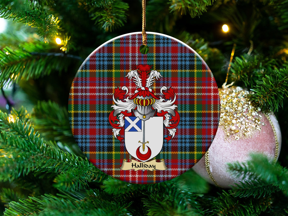 Halliday Scottish clan ceramic ornament with family crest on a Caledonia tartan background, hanging on a Christmas tree