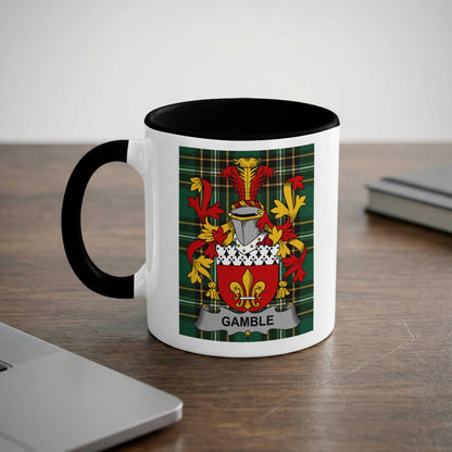 White mug with black rim and handle displaying a coat of arms with the name "GAMBLE".