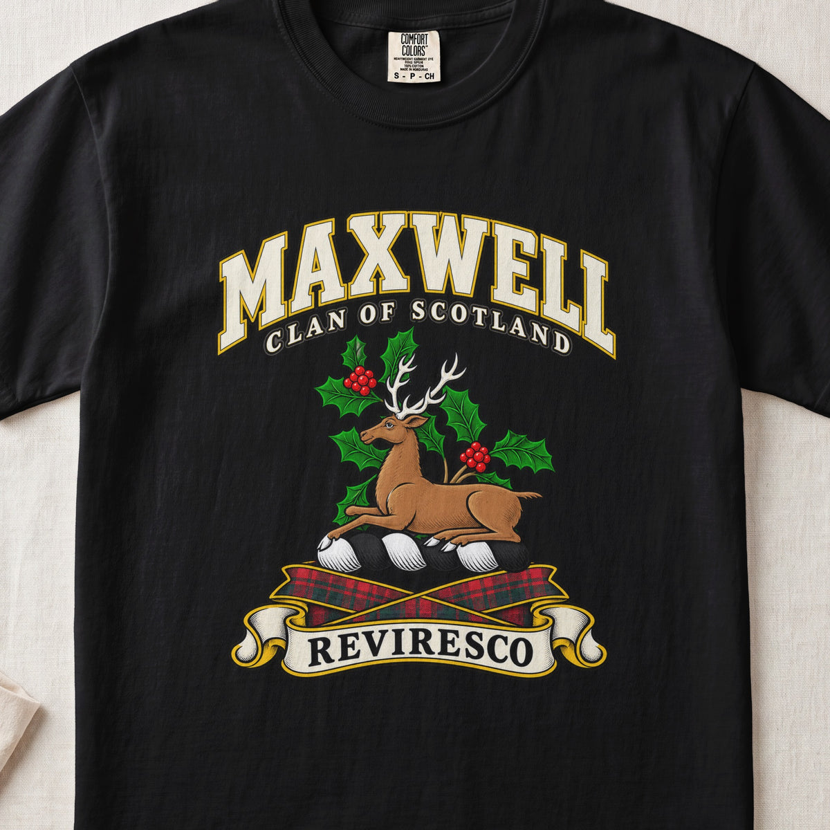 Maxwell Scottish clan T-shirt in Black, front view with a resting stag surrounded by holly leaves and red berries and motto banner.