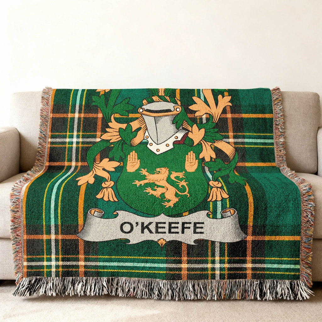 Green tartan blanket with O'Keefe family crest and lion rampant.