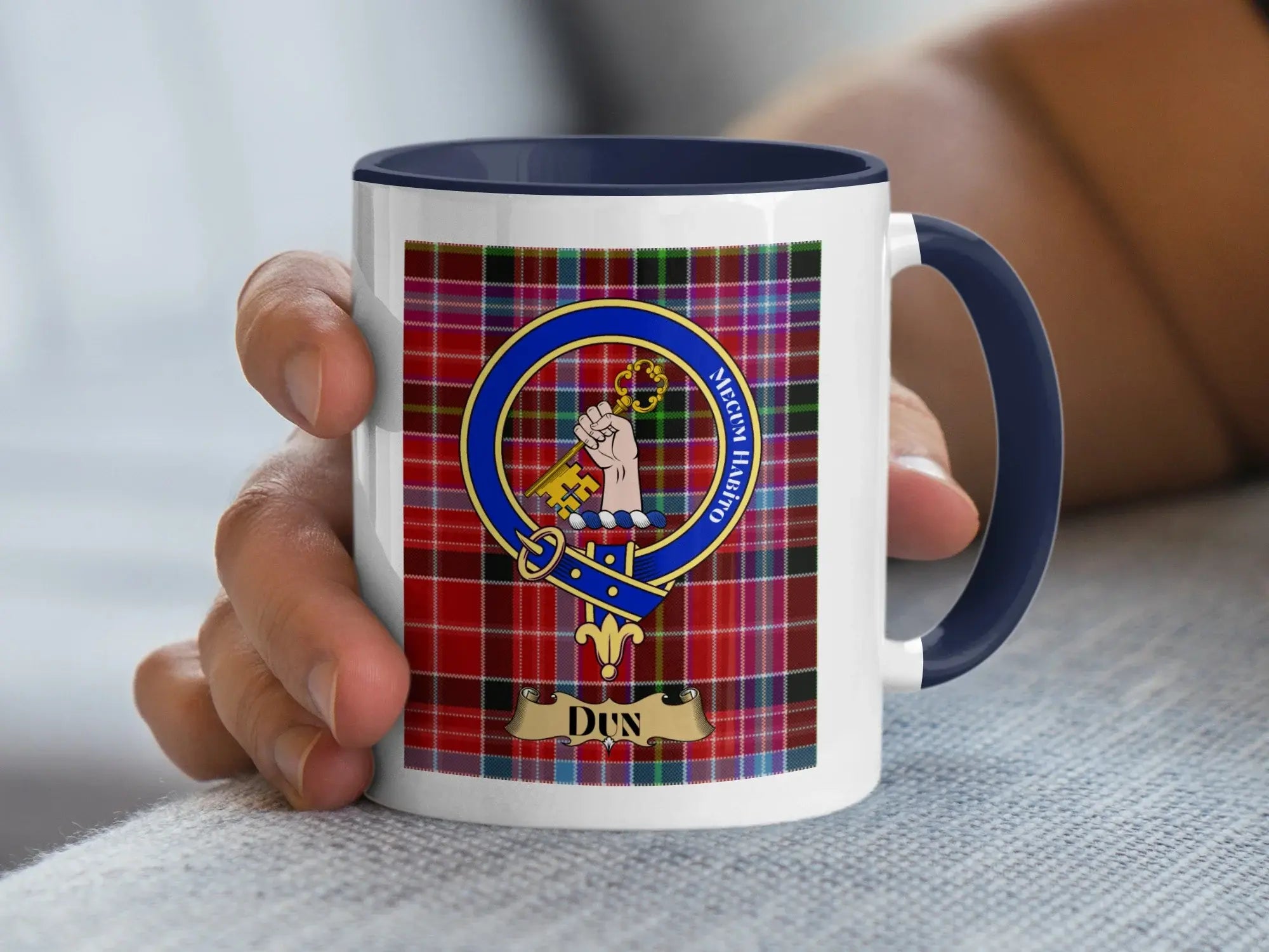 Dun family crest coffee mug with a tartan-background design
