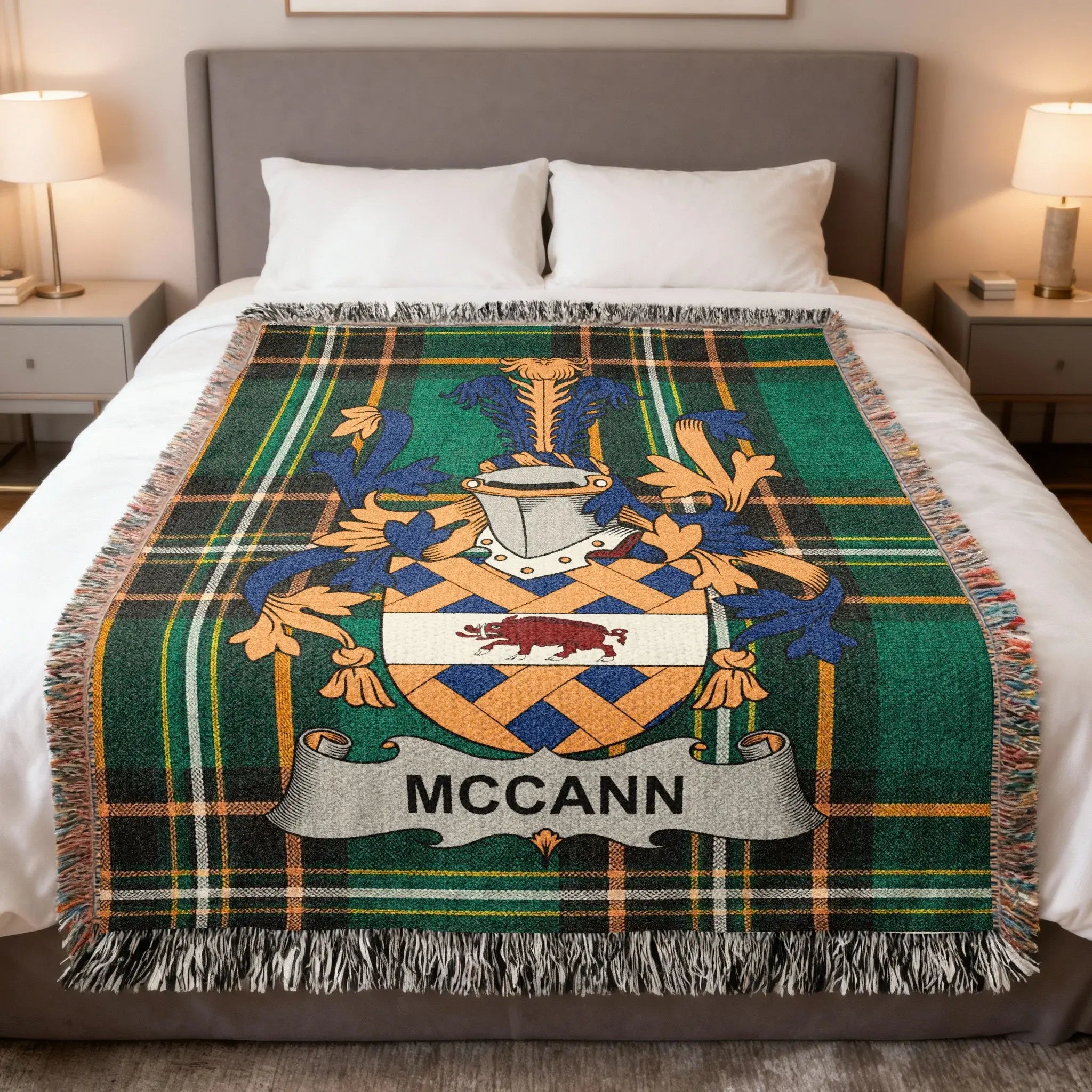 Green plaid throw blanket with MCCANN coat of arms.