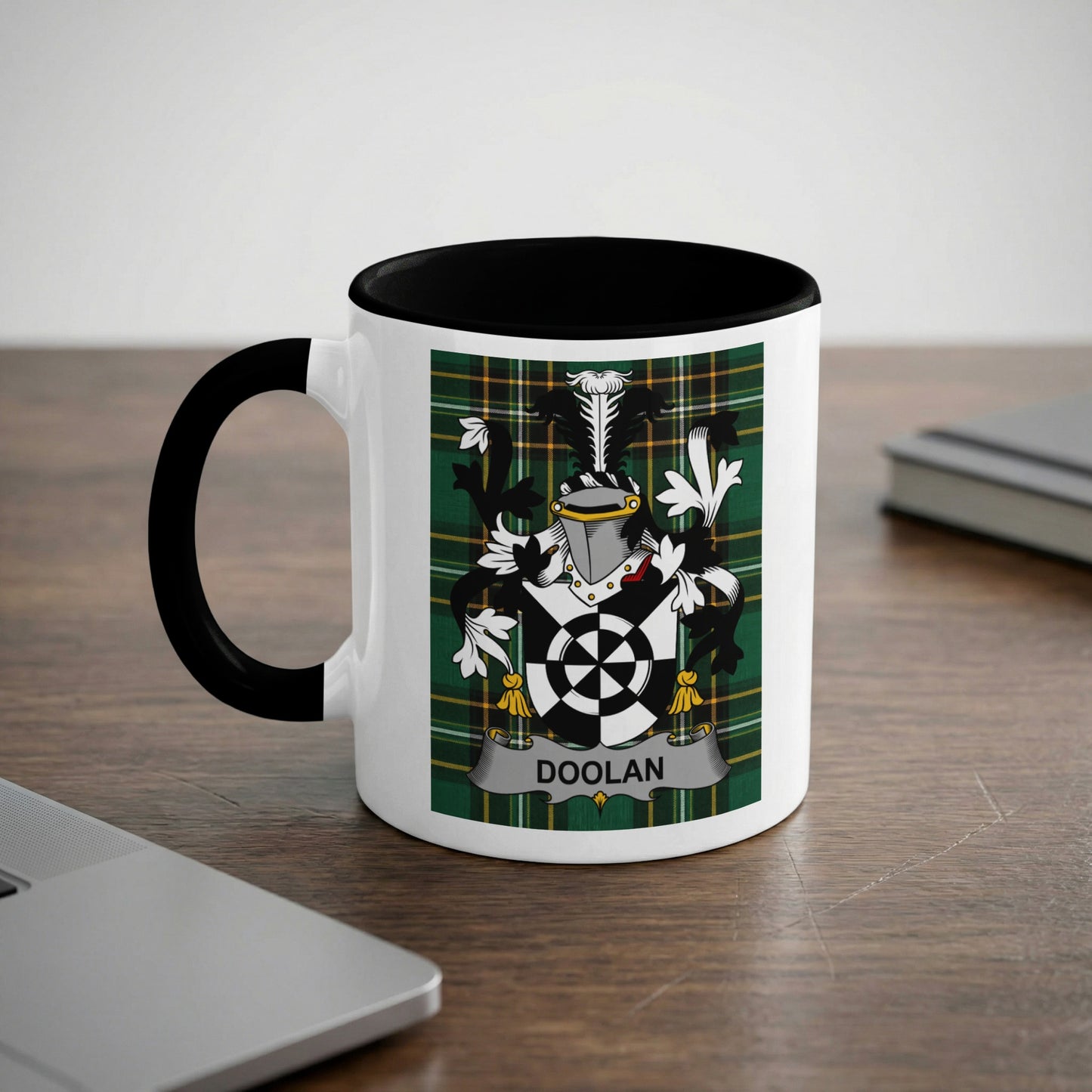 White mug with black rim featuring the DOOLAN family crest on a plaid background.