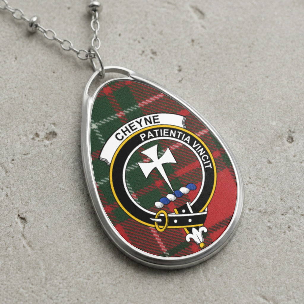 Cheyne clan Scottish tartan necklace with clan crest on tartan background