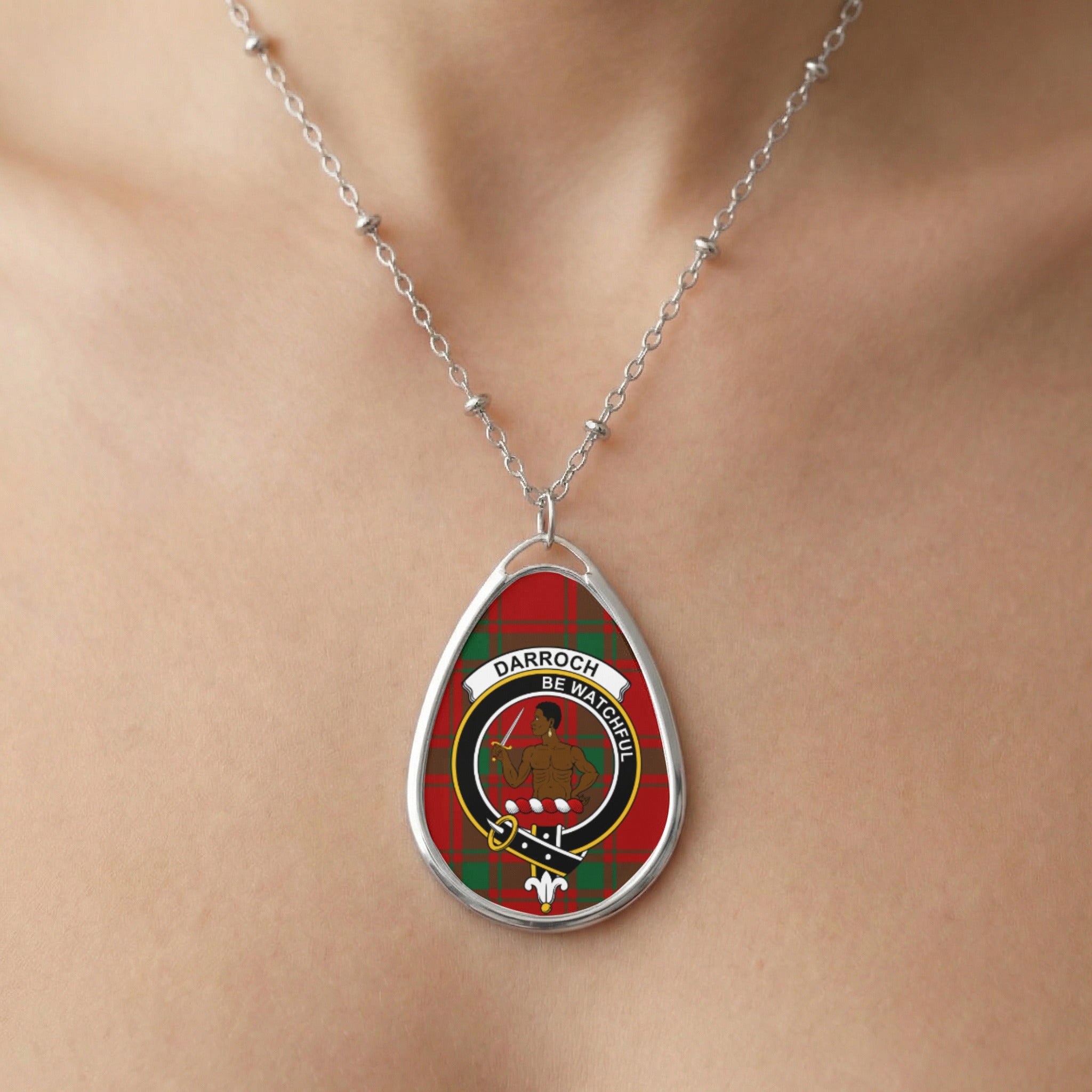 Close-up of Darroch clan tartan pendant necklace with crest design