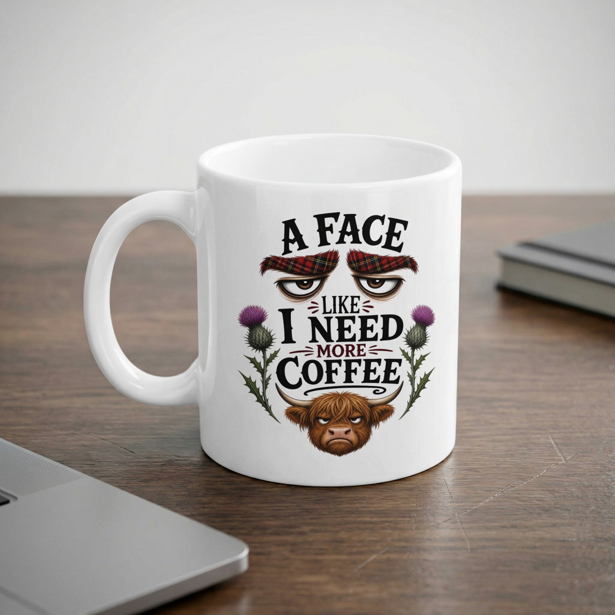 White mug with "A face like I need more coffee" and a Highland cow.