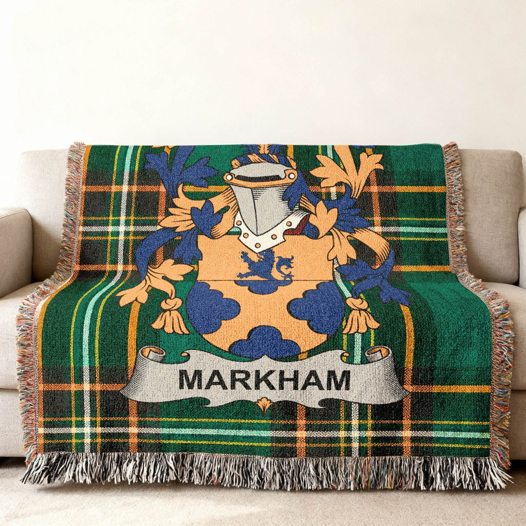Green tartan throw blanket with Markham coat of arms and fringe.