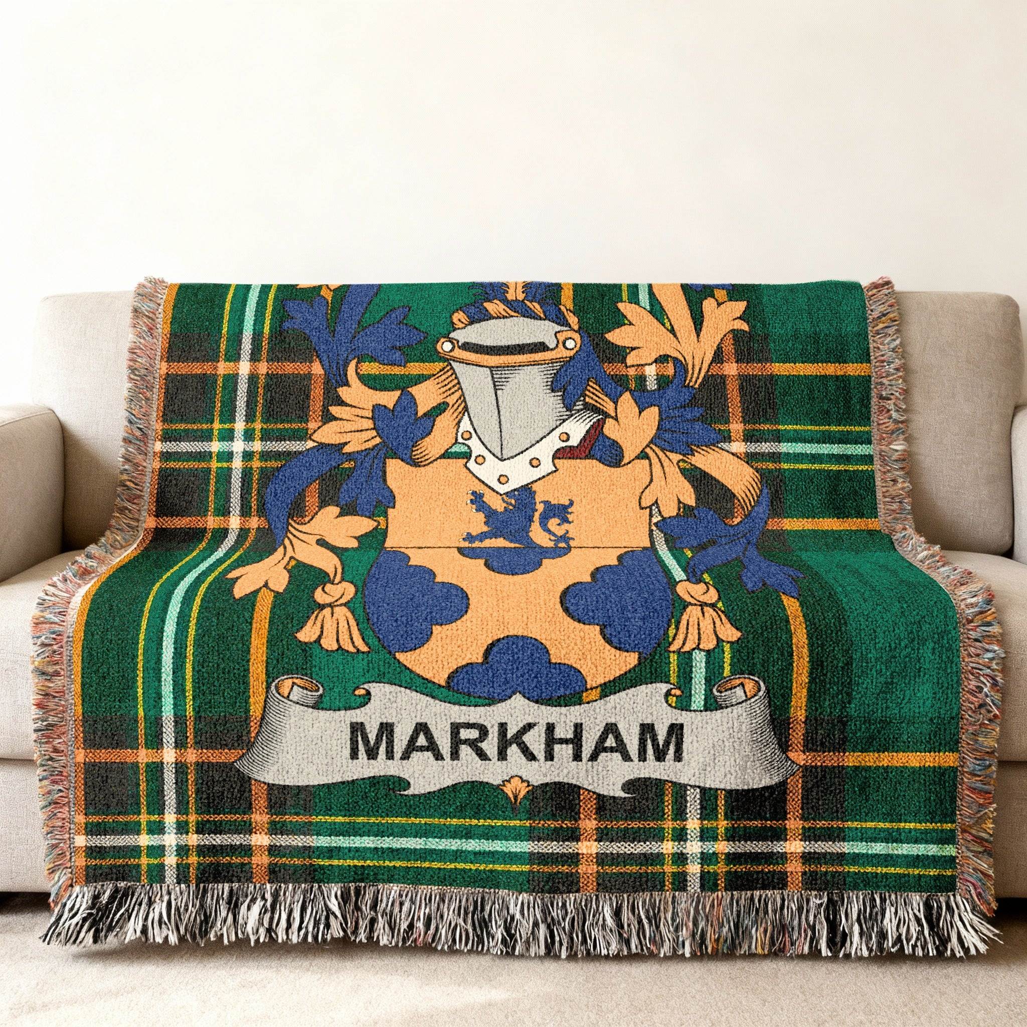 Green tartan throw blanket with Markham coat of arms and fringe.