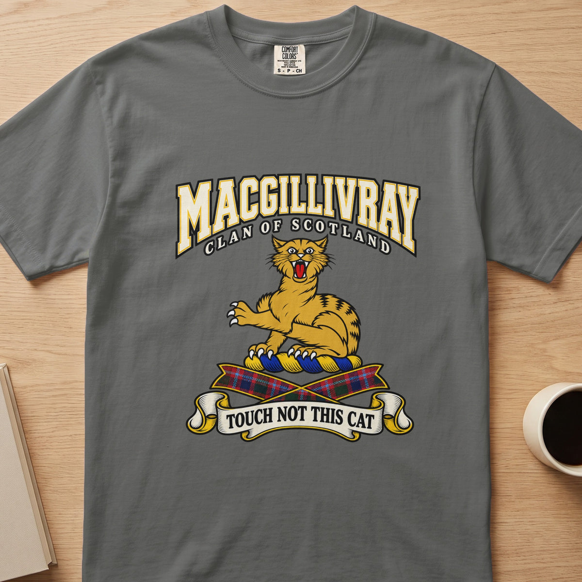 MacGillivray clan crest with gold striped cat on a gray Comfort Colors T-shirt, front view