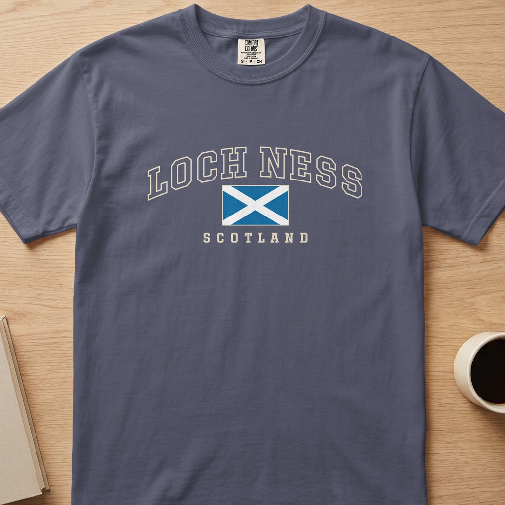 Denim Comfort Colors T-shirt laid flat with Loch Ness, Scotland lettering and a blue-and-white Saltire