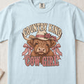 Country Kind Cow Girl Highland cow design on a Chambray Comfort Colors 1717 T-shirt, flat lay