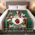 Tartan blanket with Foran family crest featuring a red hand.
