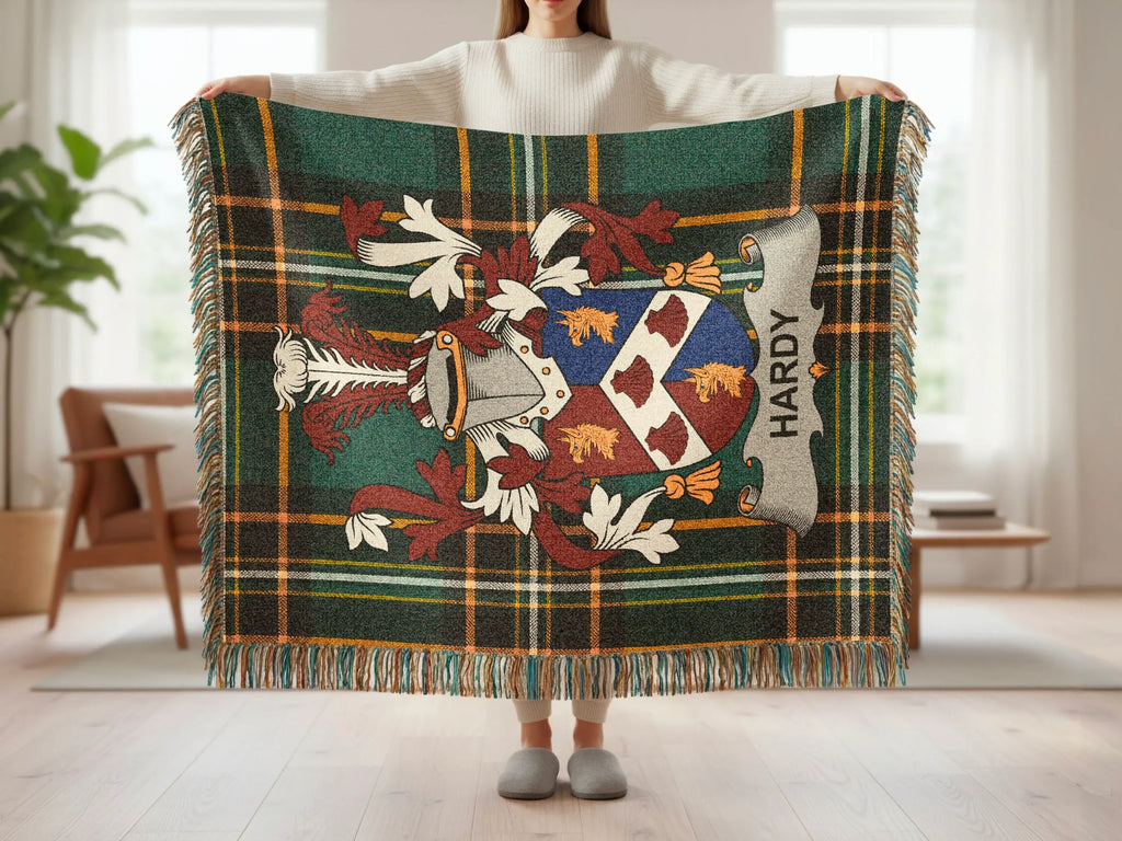 Hardy tartan throw blanket with coat of arms and fringe.