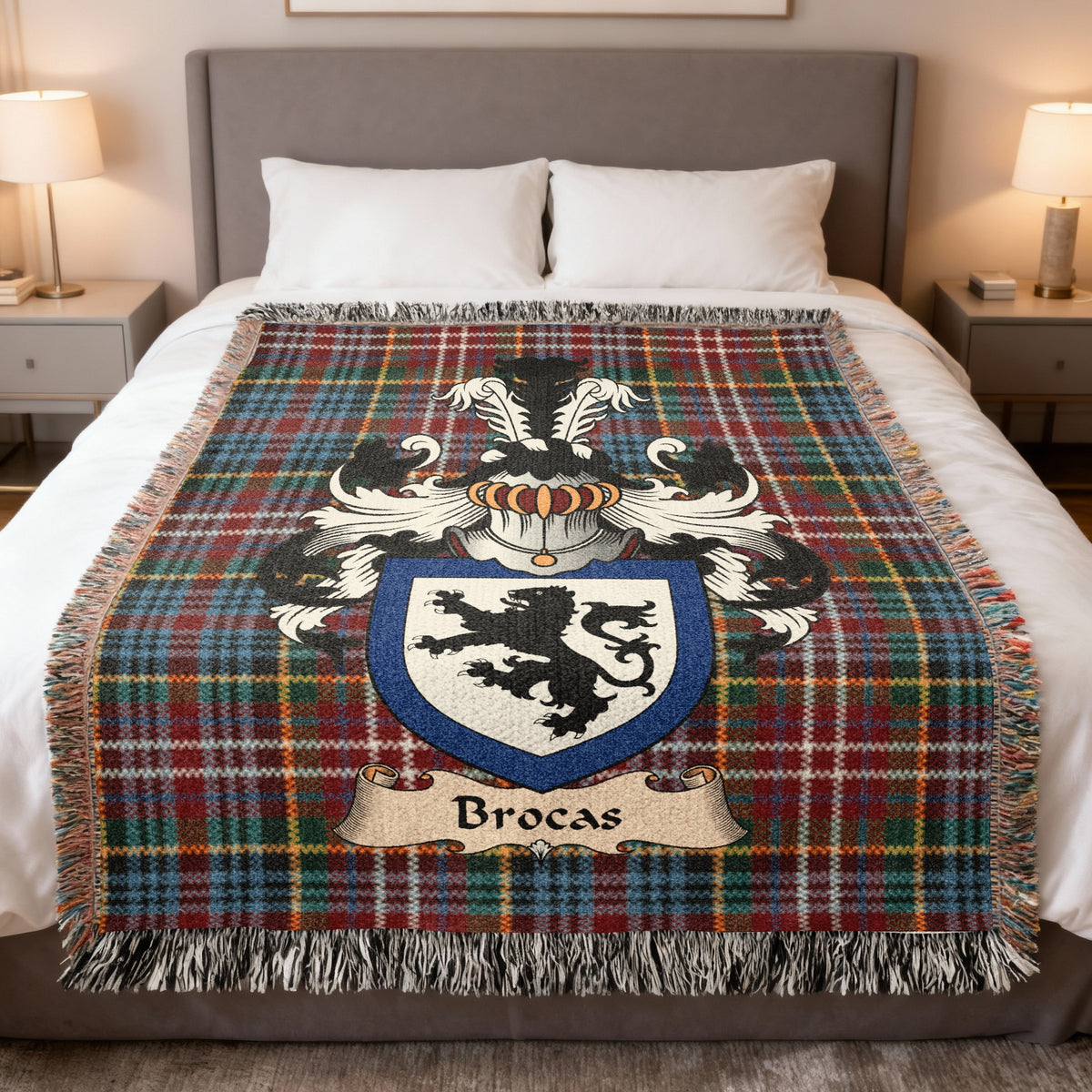 Brocas family crest emblem on a Caledonia tartan woven blanket