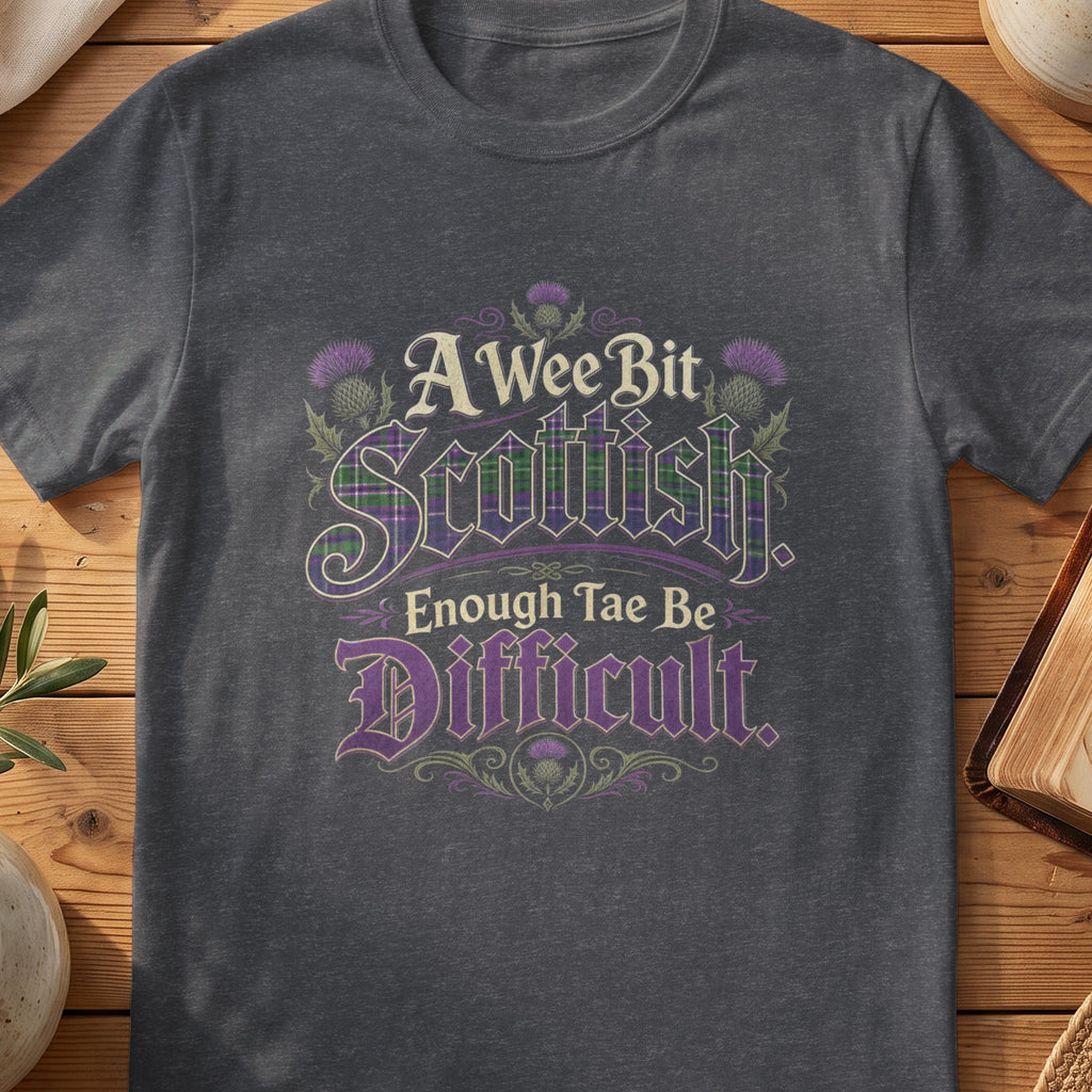 Dark grey Gildan 64000 unisex T-shirt flatlay with A Wee Bit Scottish Enough Tae Be Difficult Scottish graphic design