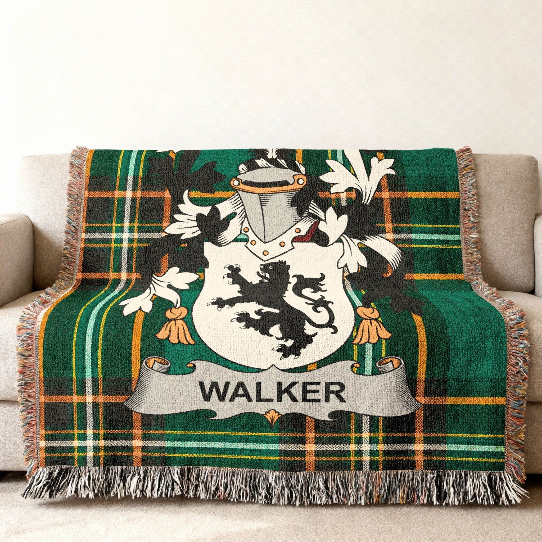 Walker family crest on a green tartan plaid throw blanket.