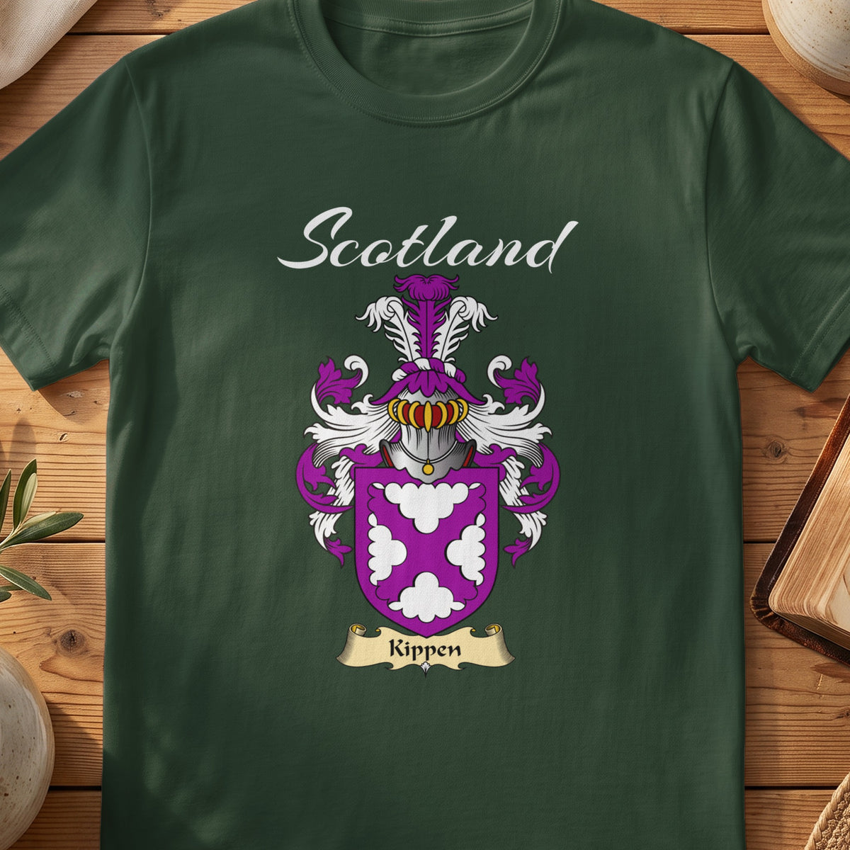 Forest Green Kippen Scottish T-shirt featuring white decorative motifs on a purple shield