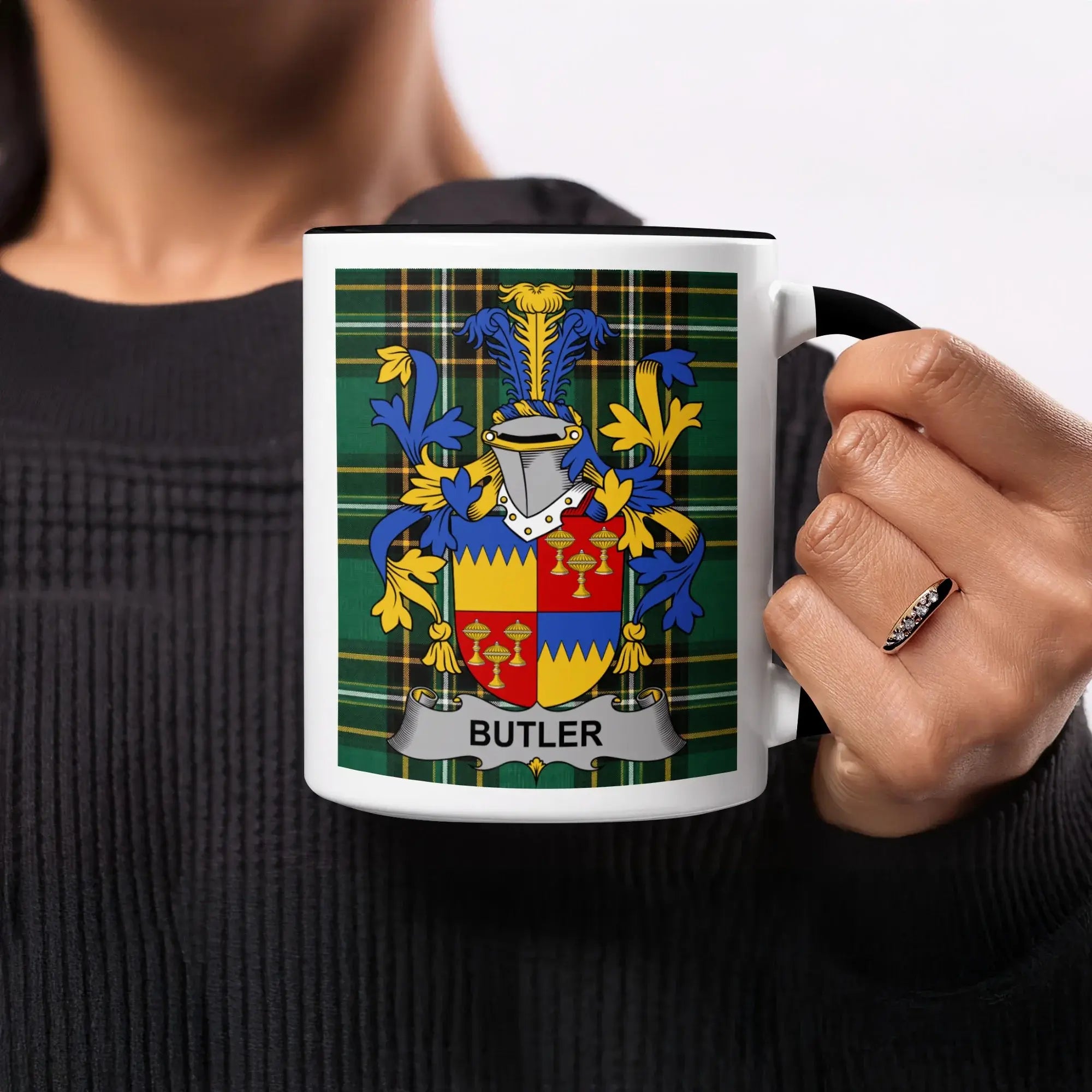 Mug featuring Butler family crest on a tartan background.