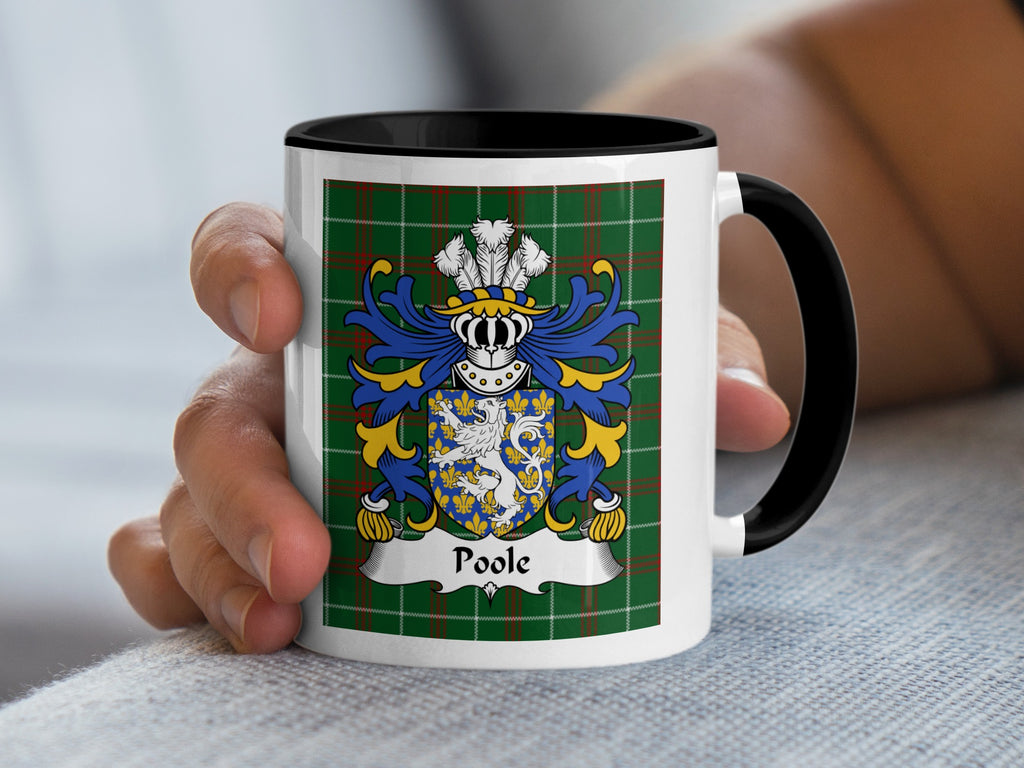 Mug with Poole family crest on green tartan background.