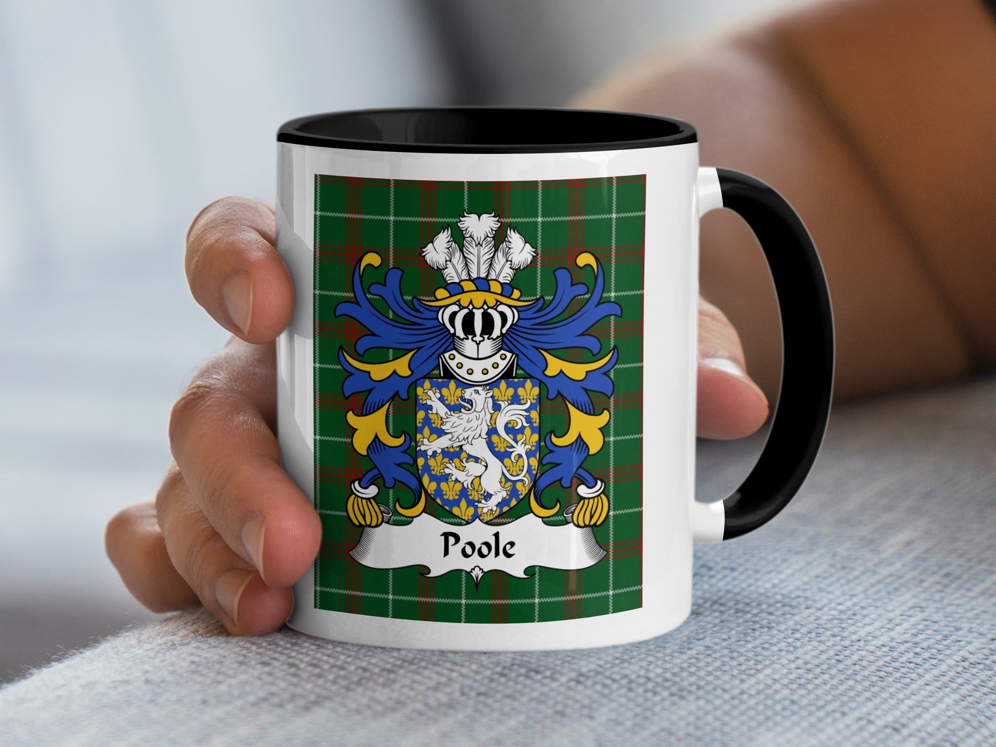Mug with Poole family crest on green tartan background.
