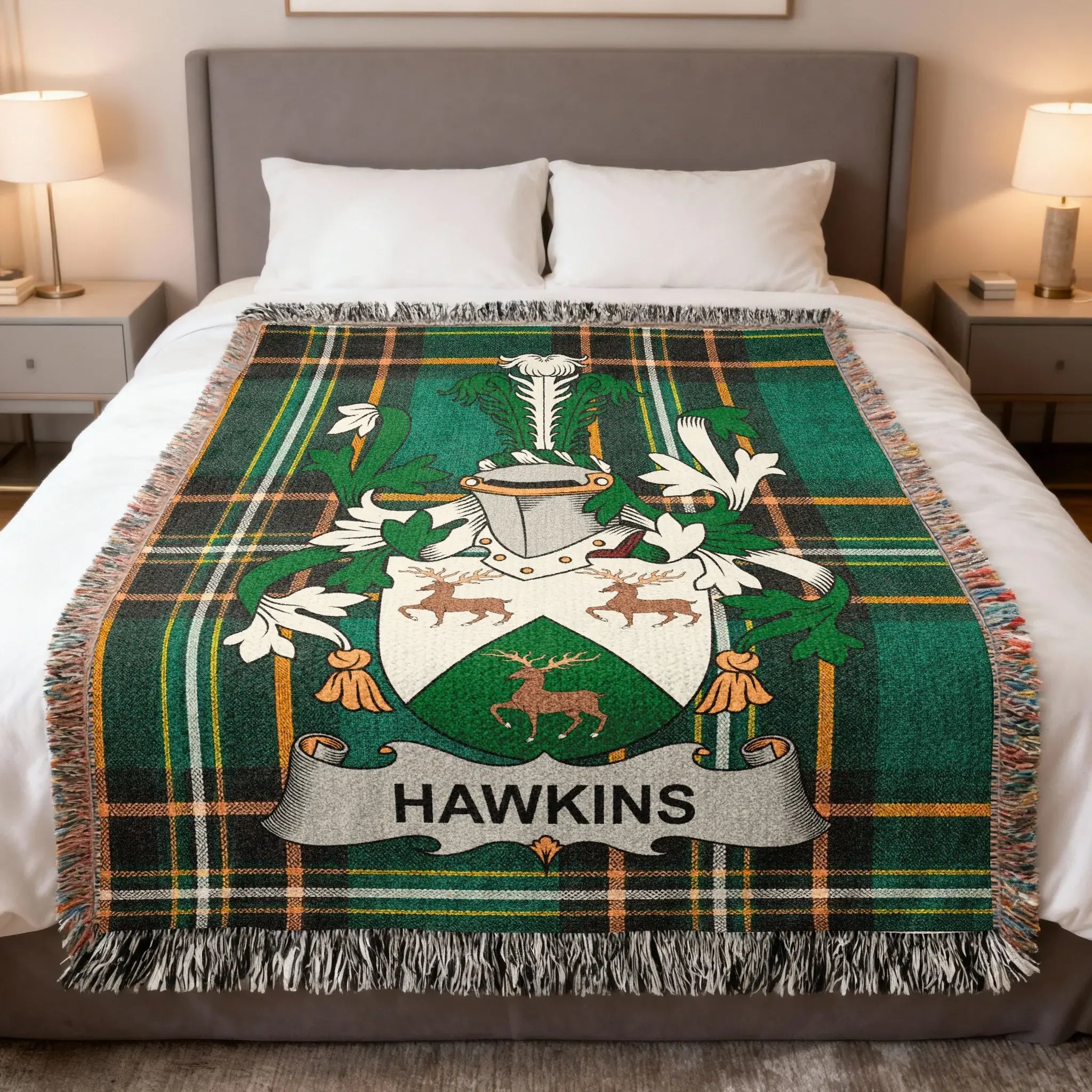 Plaid blanket with Hawkins family crest featuring deer and green accents.