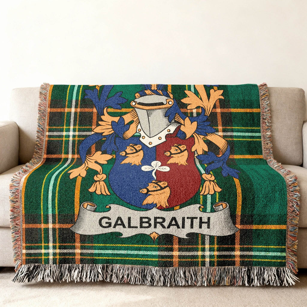 Green plaid woven blanket with the Galbraith family crest.