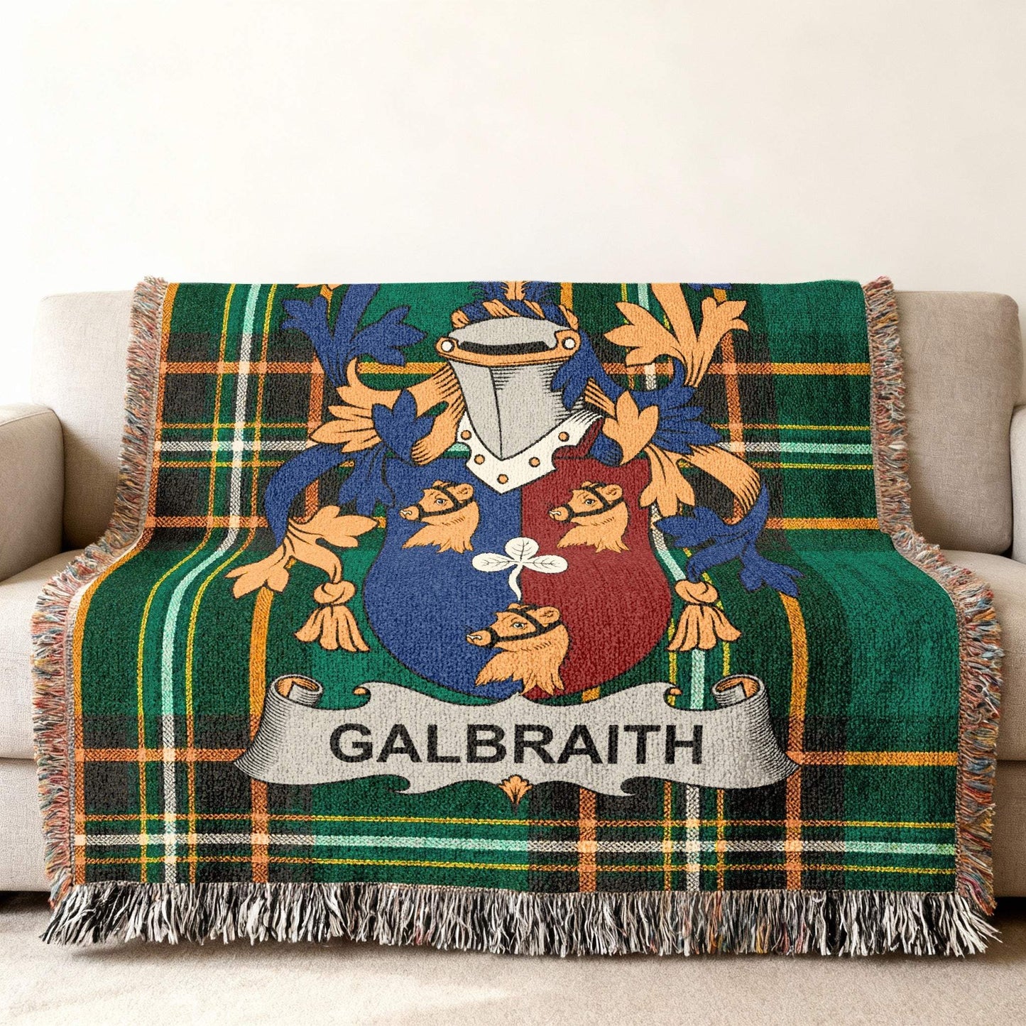 Green plaid woven blanket with the Galbraith family crest.