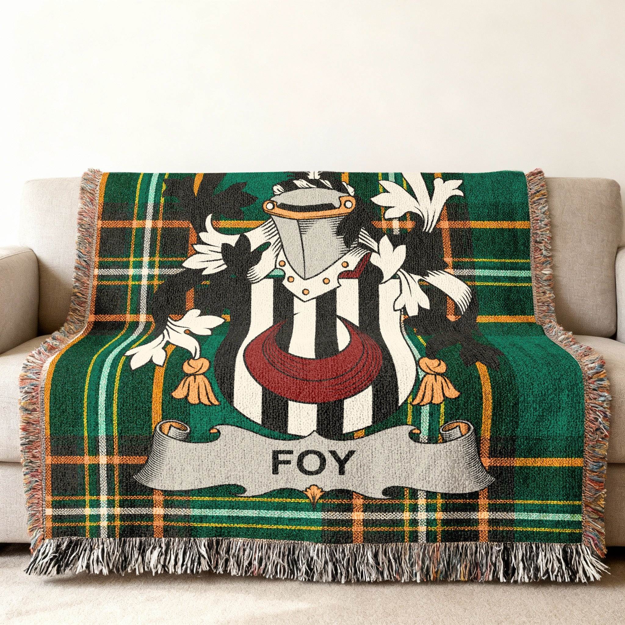 Green tartan throw blanket featuring the Foy family crest.