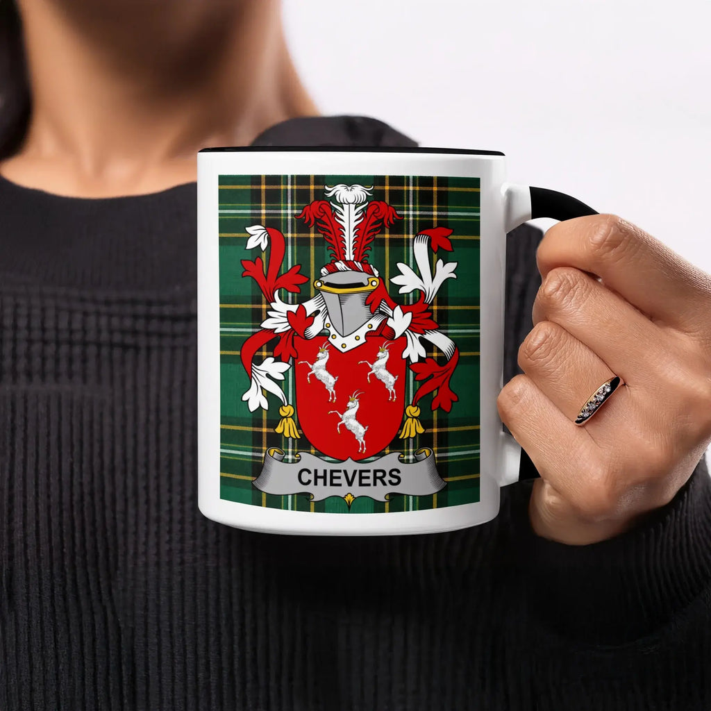 Mug with Chevers family crest on green plaid background.