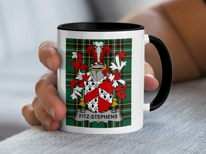 White mug with black rim featuring Fitz-Stephens family crest on plaid background.