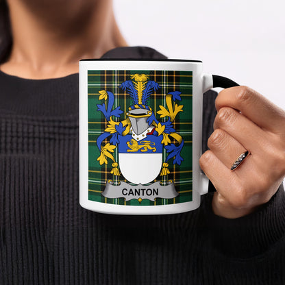 White mug with black trim displaying a green tartan and the "Canton" coat of arms.