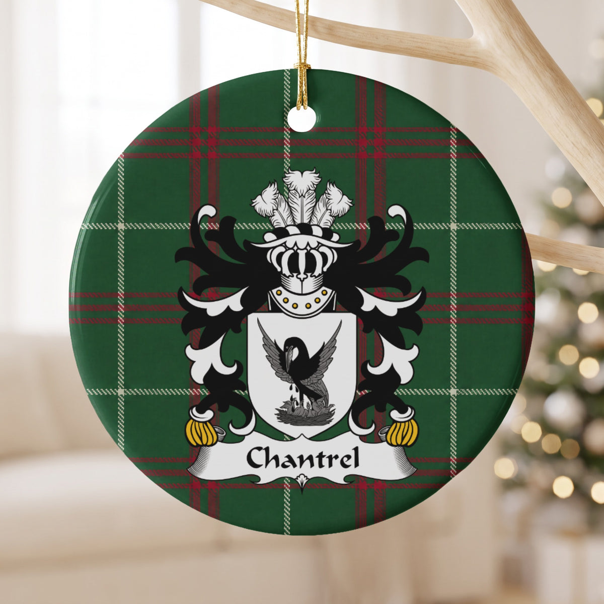 Chantrel ornament hanging from a pale wooden branch; a dark bird with raised wings above a nest on a white shield on Welsh national tartan.