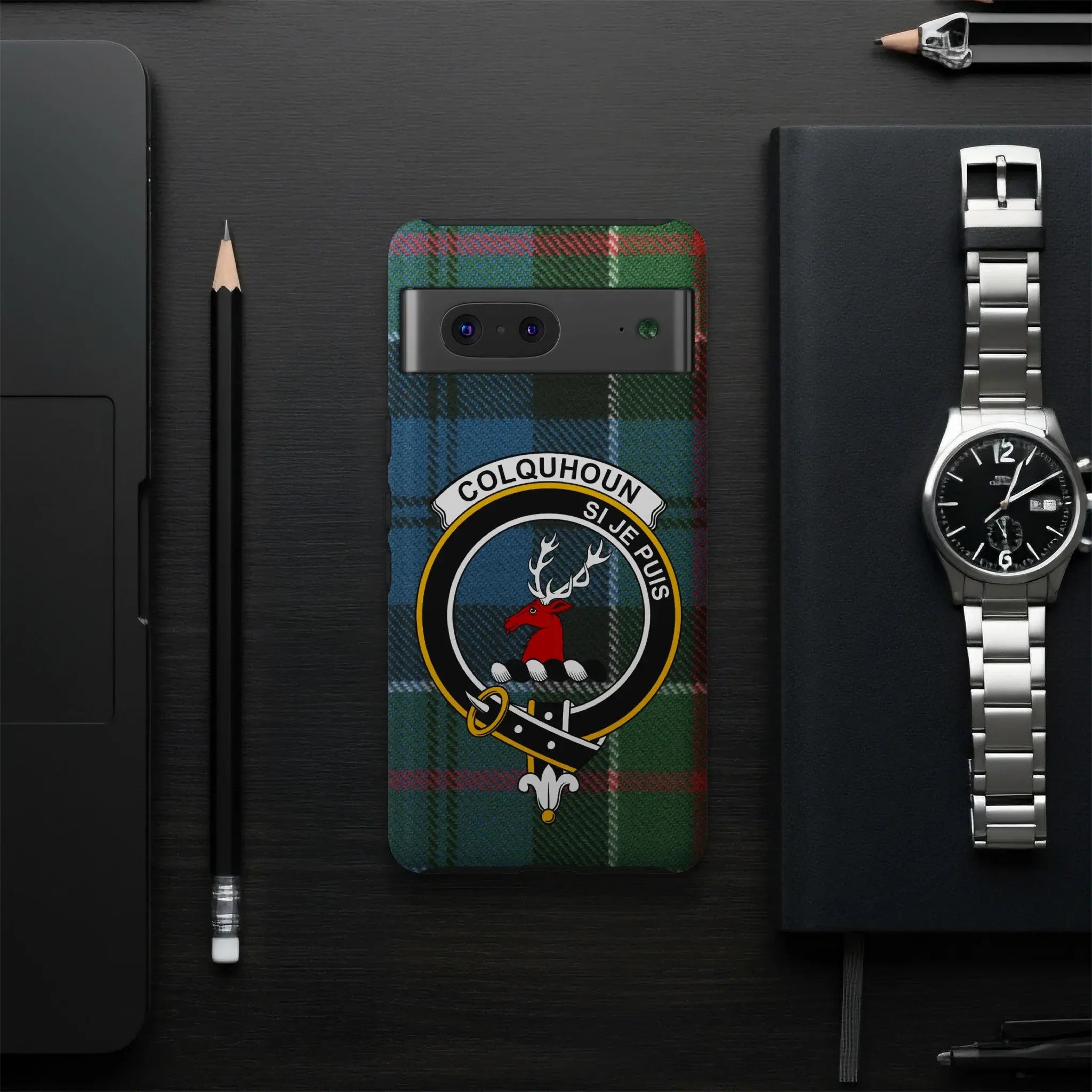 Colquhoun crest tartan phone case flat lay — full clan design with Si Je Puis motto visible