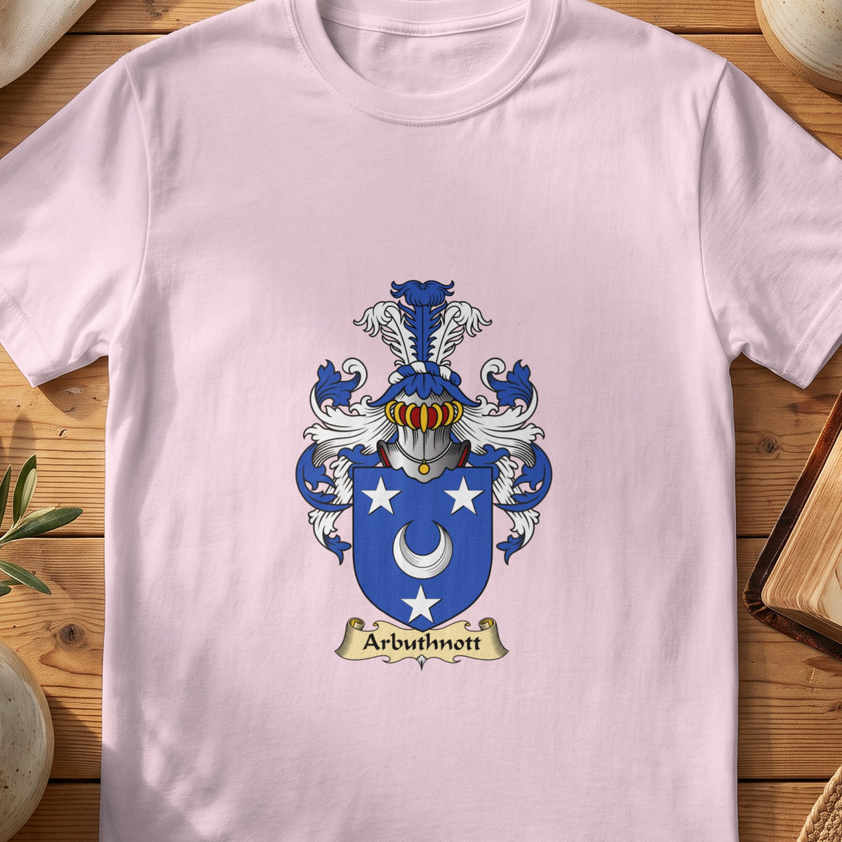 Light Pink Arbuthnott Scottish family shield T-shirt featuring a white crescent and stars on blue