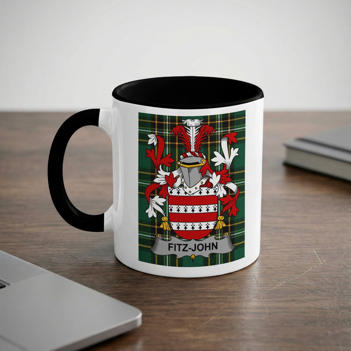 White mug with black rim displaying a Scottish tartan and a family crest with "FITZ-JOHN" text.