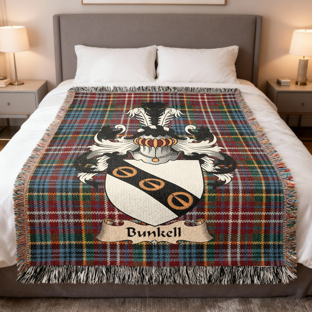 Bunkell family crest emblem on a Caledonia tartan woven blanket