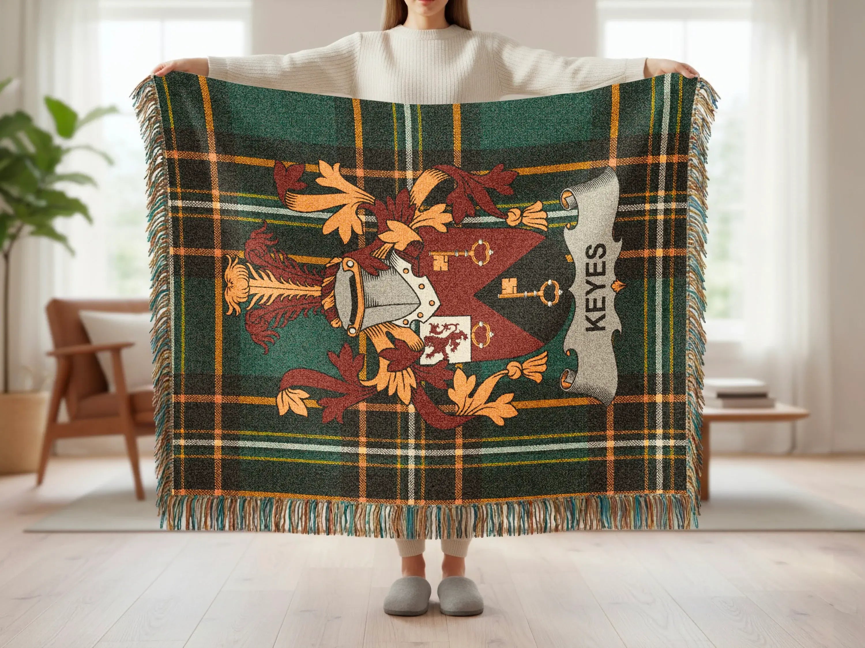 Tartan throw blanket with coat of arms and "KEYES" text.