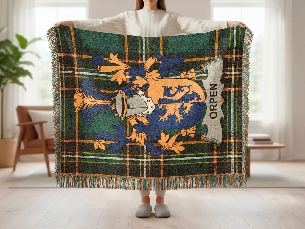 Green tartan blanket displaying the Orpen family crest.