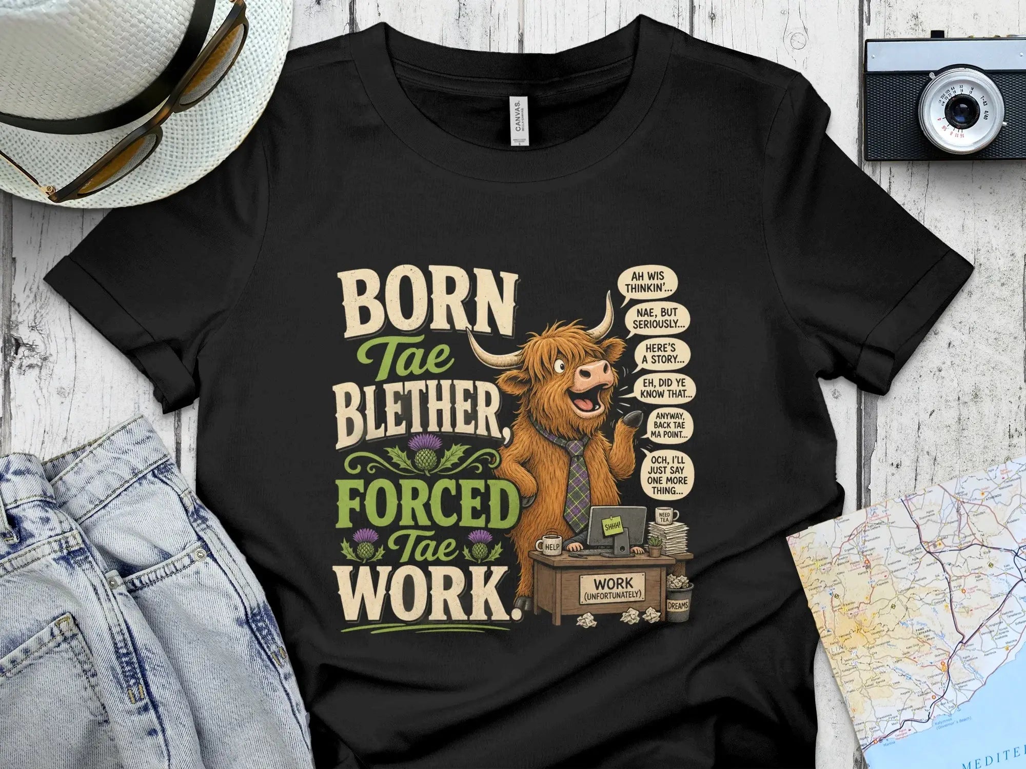 Highland cow at desk with speech bubbles and text "Born Tae Blether, Forced Tae Work."