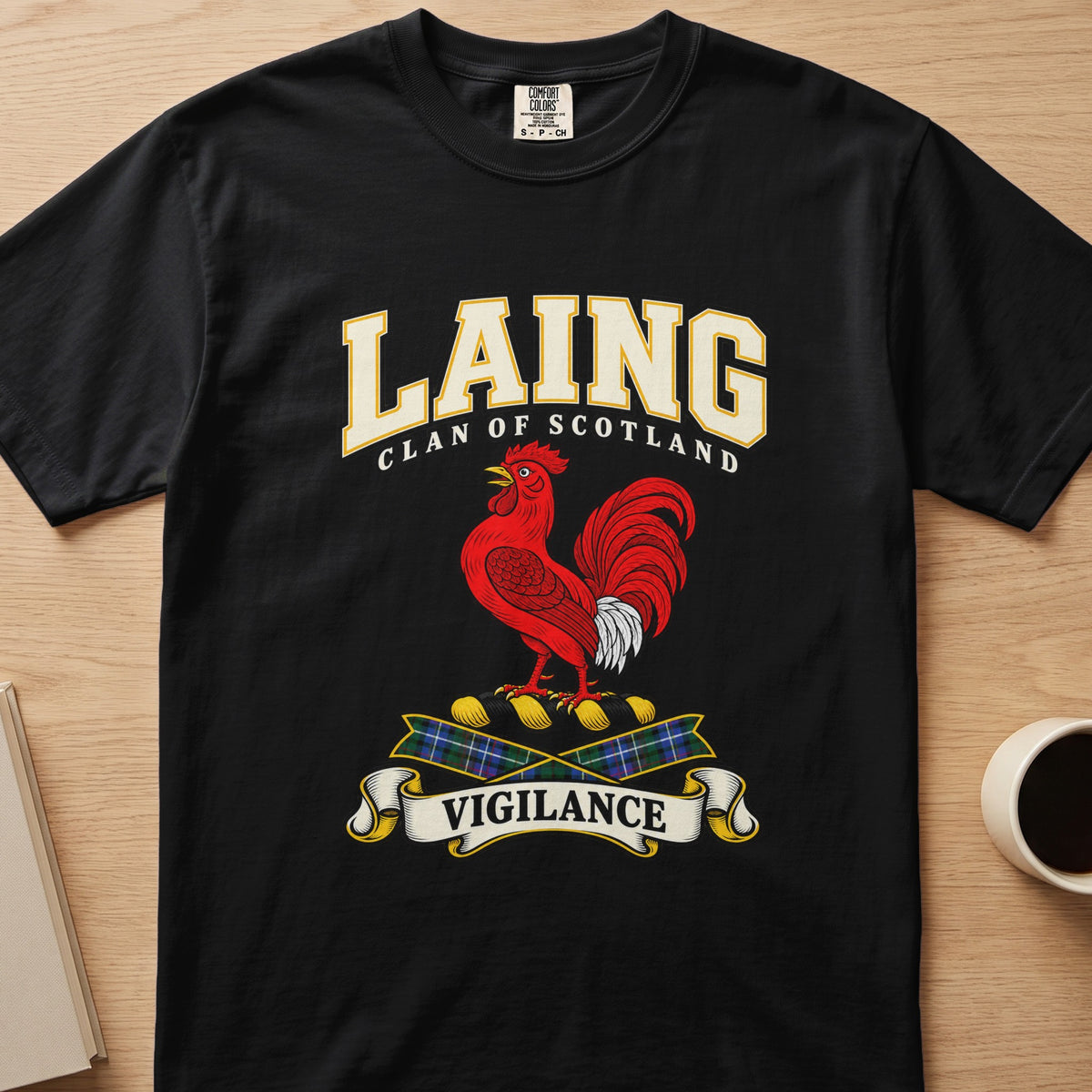 Laing clan crest with red rooster and Vigilance scroll on a black Comfort Colors T-shirt, front view