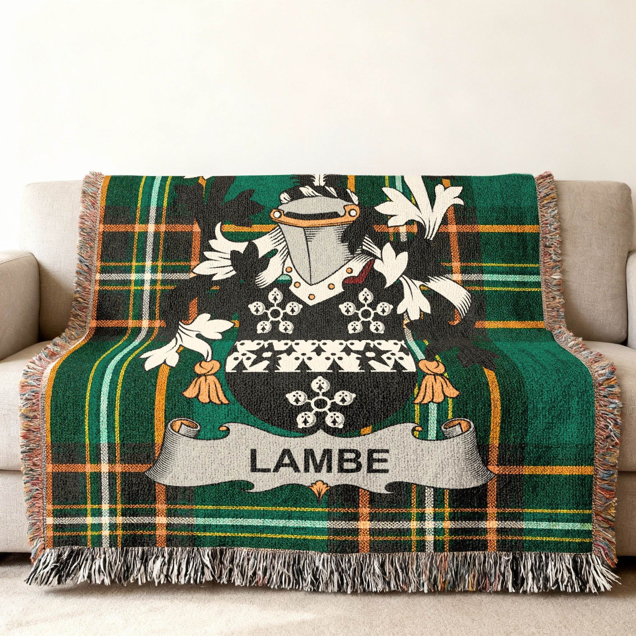 Green tartan throw blanket with the LAMBE family crest.