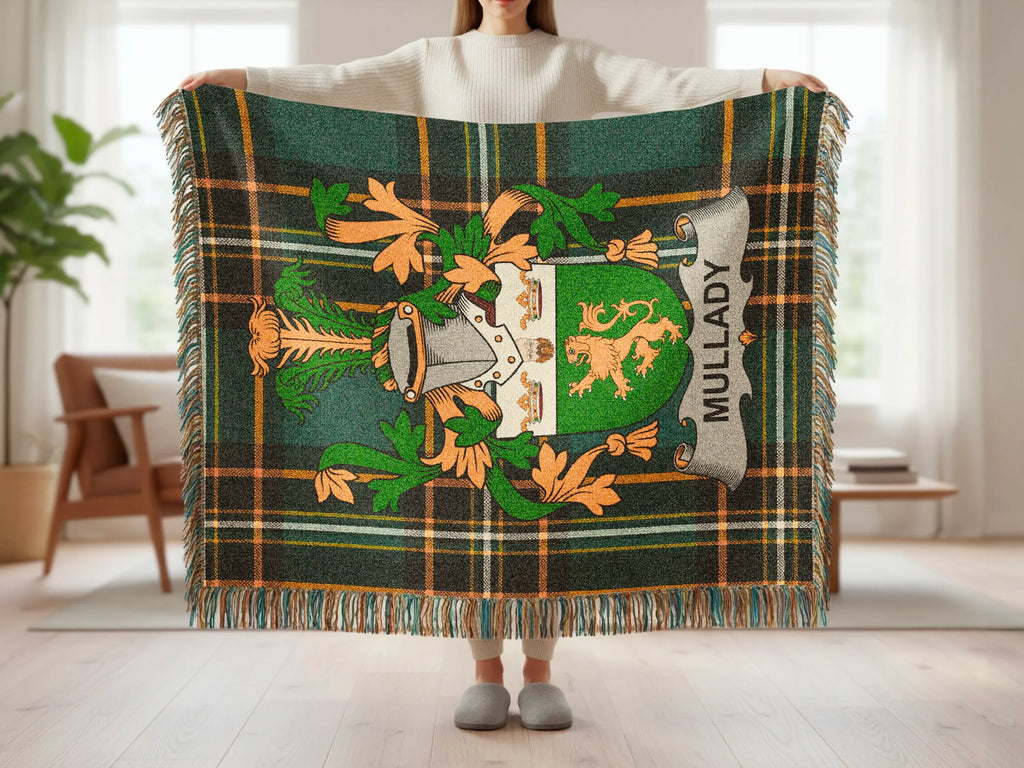 Green tartan throw blanket featuring a Mullady coat of arms with fringed edges.