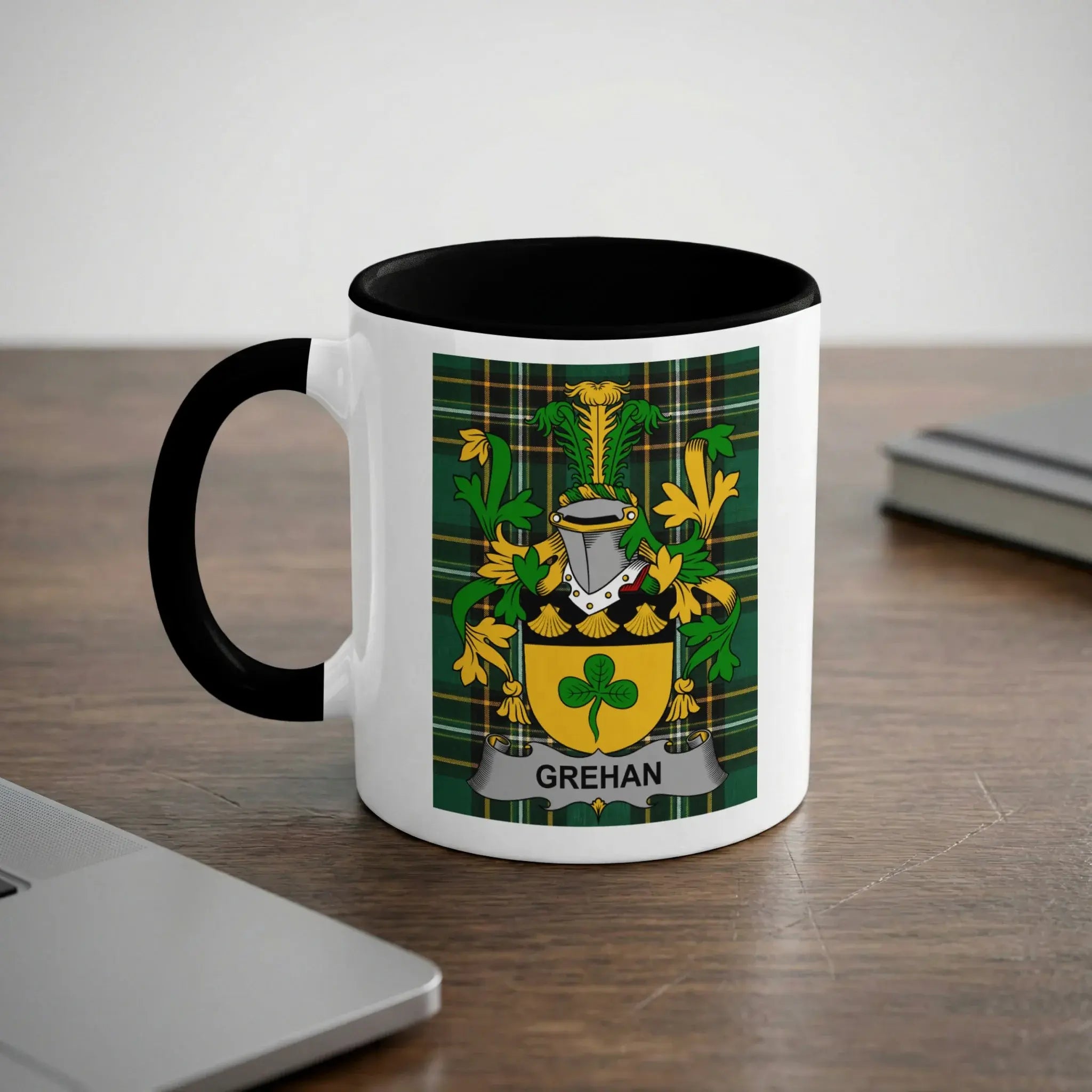 White mug with black handle featuring the Grehan family crest.