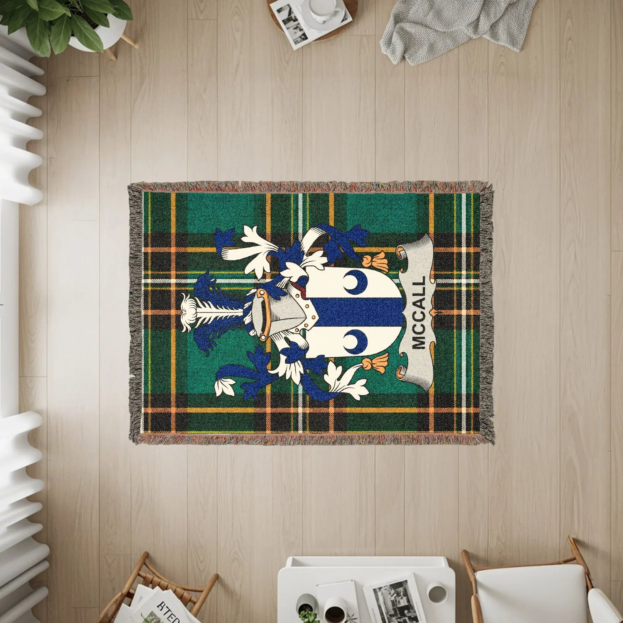 McCall family crest on a green and blue plaid woven throw blanket.
