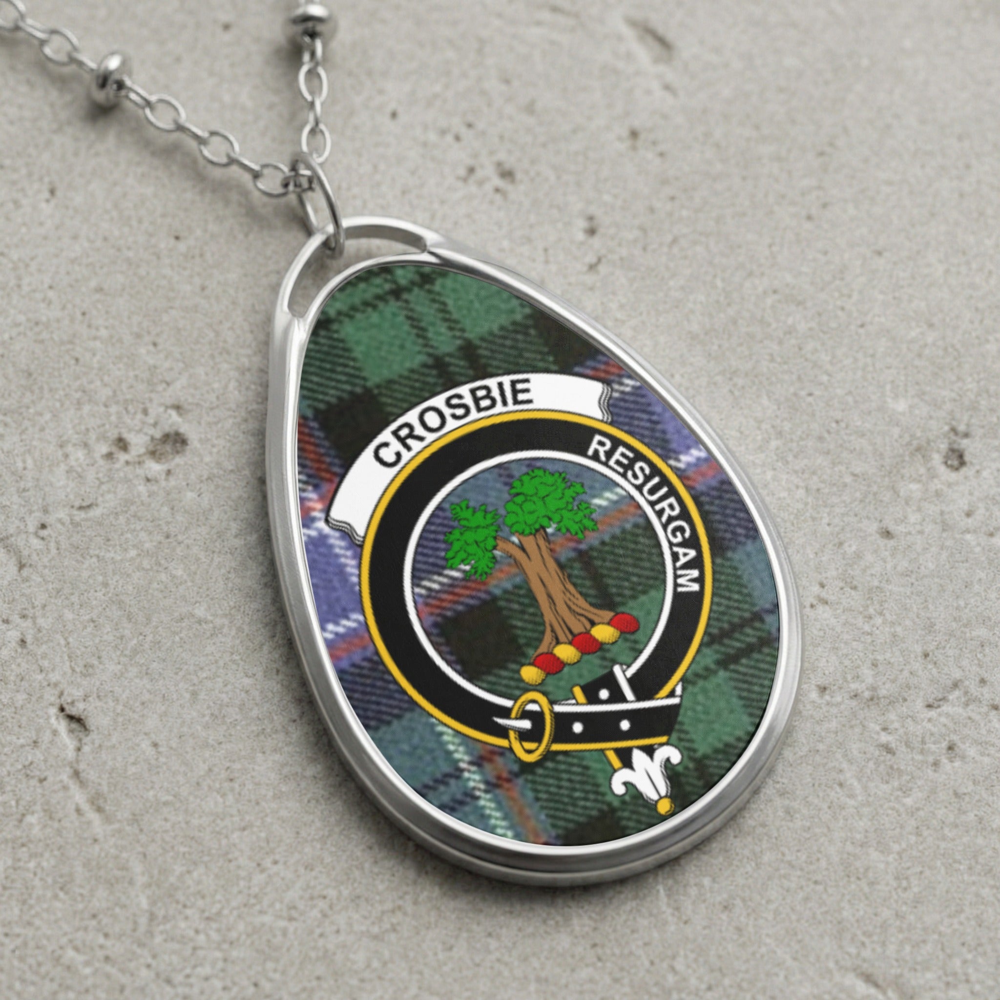 Crosbie clan Scottish tartan necklace with clan crest on tartan background