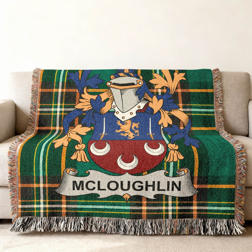 Green tartan throw blanket with McLoughlin family crest.