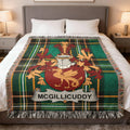McGillicuddy crest on a green plaid throw blanket with fringe.