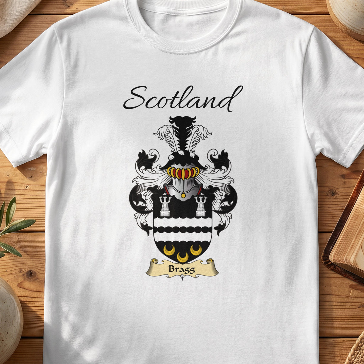 White Bragg Scottish family shield T-shirt featuring white towers and gold crescents on black